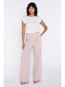 Nife Spodnie w kolorze jasnoróżowym rozmiar: 40. Różowe spodnie z wysokim stanem Nife, bez wzorów, z materiału, z podwyższonym stanem. Za 245,38 zł.