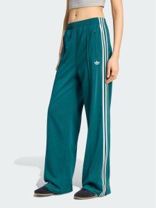 Adidas Spodnie dresowe FIREBIRD Zielony Loose Fit. Zielone spodnie dresowe ADIDAS, xl, bez wzorów, z dresówki. Za 298,99 zł.