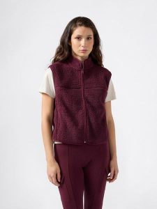 Champion Kamizelka polarowa w kolorze fioletowym rozmiar: L. Różowe kamizelki Champion, l, bez wzorów, z polaru, bez kołnierzyka, bez ramiączek, bez kaptura. Za 122,38 zł.