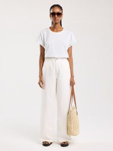 BIG STAR Koszulka w kolorze błękitno-białym rozmiar: M. Białe bluzki Big Star, m, bez wzorów, z bawełny, retro, bez kołnierzyka, bez ramiączek. Za 39,99 zł.