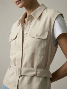 Koszula bez rękawów z wiskozą i domieszką lnu - beżowy. Brązowe koszule Sinsay, l, bez wzorów, z wiskozy, bez kołnierzyka, bez ramiączek. Za 49,99 zł.