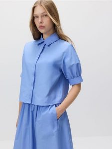 Koszula z bufiastymi rękawami - niebieski. Niebieskie koszule Reserved, l, bez wzorów, z bawełny, bez kołnierzyka, bez ramiączek. W wyprzedaży za 69,99 zł.
