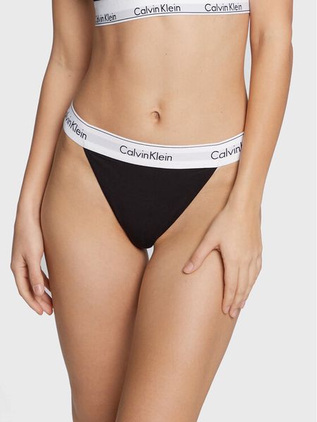 Calvin Klein Underwear Stringi 000QF7013E Czarny. Czarne stringi Calvin Klein Underwear, bez wzorów, z bawełny. Za 69,99 zł.