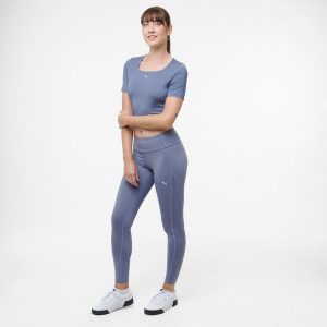 Legginsy fitness damskie Puma. Fioletowe legginsy Puma, bez wzorów, ze skóry. Za 129,99 zł.