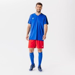 Koszulka piłkarska Kipsta Essential Club. Niebieskie bluzki KIPSTA, l, bez wzorów, z materiału, sportowe, bez kołnierzyka, bez ramiączek. Za 29,99 zł.