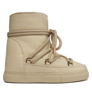 Śniegowce Inuikii. Brązowe buty zimowe Inuikii, bez obcasa, bez zapięcia. Za 879,99 zł.