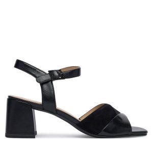 Sandały Caprice. Czarne sandały Caprice, bez wzorów, bez obcasa, na słupku, bez zapięcia. Za 329,99 zł.