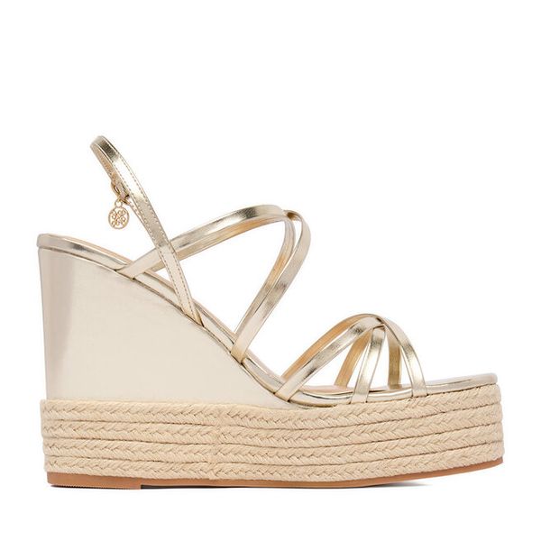 Sandały Nine West. Żółte sandały Nine West, bez wzorów, bez obcasa, na koturnie, bez zapięcia. Za 229,99 zł.