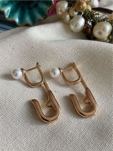 Luseera Pozłacane kolczyki rozmiar: onesize. Czerwone kolczyki Luseera, z perłą, pozłacane. Za 43,99 zł.