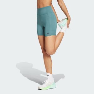 Legginsy Own the Run Short. Niebieskie szorty ADIDAS, bez wzorów, z materiału, sportowe. W wyprzedaży za 164,25 zł.
