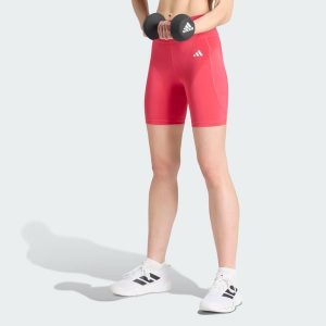 Krótkie legginsy Optimé Essentials Stash Pocket 7-Inch. Zielone legginsy ADIDAS, bez wzorów, z elastanu, z podwyższonym stanem, krótkie. Za 149,00 zł.