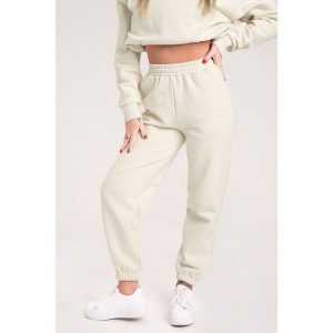 Spodnie fitness damskie Gym Glamour dresowe off. Białe spodnie dresowe GYM GLAMOUR, l, bez wzorów, z dresówki. Za 189,99 zł.