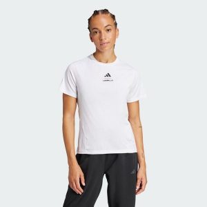 Koszulka Les Mills Graphic. Białe bluzki ADIDAS, m, bez wzorów, sportowe, bez kołnierzyka, bez ramiączek. W wyprzedaży za 129,35 zł.