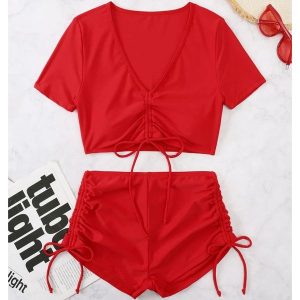 Strój kąpielowy z szortami i crop topem szybkoschnący na plażę Rutt. Czerwone stroje jednoczęściowe Intica, bez wzorów, z materiału. Za 129,00 zł.