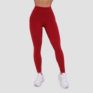 Legginsy damskie fitness z kieszeniami ciemnoczerwone Ignite. Czerwone legginsy GYMBEAM, bez wzorów, z elastanu. Za 112,90 zł.