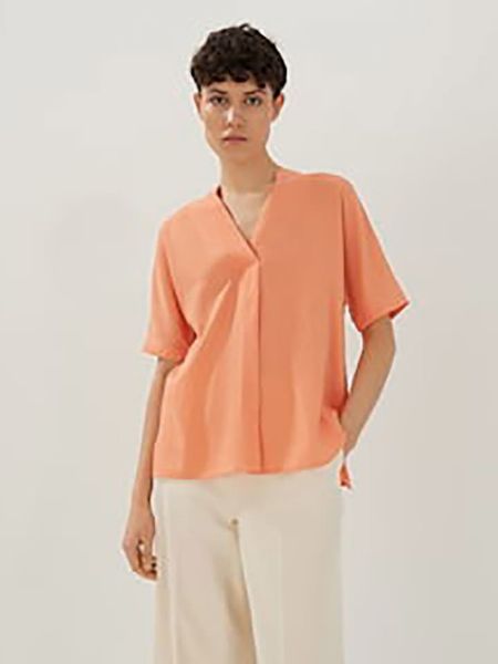 Someday Bluzka "Zerike" w kolorze brzoskwiniowym rozmiar: 38. Pomarańczowe bluzki someday., bez wzorów, bez kołnierzyka, bez ramiączek. Za 69,91 zł.