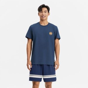 Koszulka koszykówki unisex Tarmak NBA Knicks TS 900. Niebieskie bluzki TARMAK, xs, bez wzorów, z bawełny, sportowe, bez kołnierzyka, bez ramiączek. Za 79,99 zł.