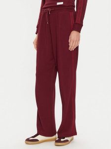 Tommy Hilfiger Spodnie dresowe UW0UW04771 Bordowy Relaxed Fit. Czerwone spodnie dresowe TOMMY HILFIGER, xl, bez wzorów, z dresówki. Za 259,99 zł.