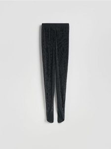 Legginsy z ozdobną aplikacją - czarny. Czarne legginsy Reserved, z aplikacjami, z dzianiny. Za 199,99 zł.