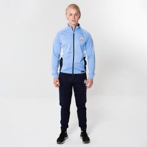 Dres piłkarski dla dorosłych Manchester City. Niebieskie kombinezony MANCHESTER CITY, s, bez wzorów, z dresówki, sportowe, bez kołnierzyka, bez ramiączek. Za 388,60 zł.