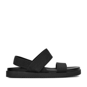 Sandały JENNY. Czarne sandały Jenny, bez wzorów, bez obcasa, na płaskiej podeszwie, bez zapięcia. Za 89,99 zł.