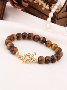 L'Atelier de Gaia Pozłacana bransoletka z tygrysim okiem rozmiar: onesize. Brązowe bransoletki L'Atelier de Gaia, pozłacane. Za 83,22 zł.