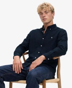 Superdry Klasyczna koszula Oxford z długim rękawem – 100% bawełna organiczna,. Niebieskie koszule Superdry, s, bez wzorów, z bawełny, bez kołnierzyka, bez ramiączek. Za 323,85 zł.