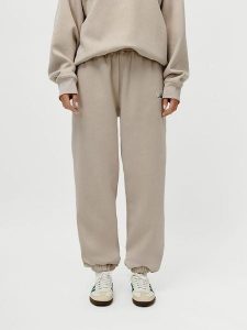 LeGer Spodnie dresowe "Maxime" w kolorze beżowym rozmiar: 38. Brązowe spodnie dresowe LeGer, bez wzorów, z dresówki. Za 105,63 zł.