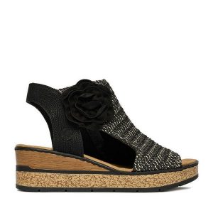Sandały Rieker. Czarne sandały Rieker, bez wzorów, bez obcasa, na koturnie, bez zapięcia. Za 359,99 zł.