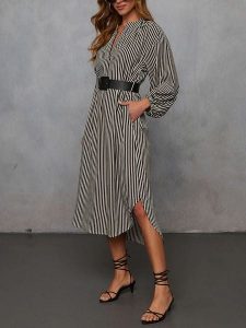 Milan Kiss Sukienka w kolorze czarno-beżowym rozmiar: S. Brązowe sukienki Milan Kiss, s, bez wzorów, bez kołnierzyka, bez ramiączek, midi. Za 173,99 zł.