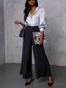 LA Angels Spodnie w kolorze czarnym rozmiar: S. Czarne spodnie z wysokim stanem LA Angels, bez wzorów, z materiału, z podwyższonym stanem. Za 191,42 zł.