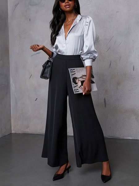 LA Angels Spodnie w kolorze czarnym rozmiar: S. Czarne spodnie z wysokim stanem LA Angels, bez wzorów, z materiału, z podwyższonym stanem. Za 170,07 zł.