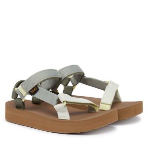 Sandały Teva. Zielone sandały Teva, bez wzorów, bez obcasa, na koturnie, bez zapięcia. Za 329,99 zł.