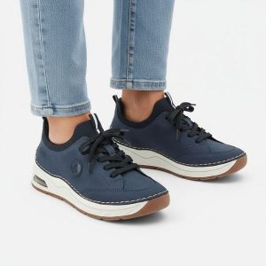 Półbuty damskie Rieker, cholewka ze skóry ekologicznej gładkiej klasyczne wsuwane lekka sportowa forma amortyzowana podeszwa, niebieskie, 44562-14. Niebieskie półbuty Rieker, bez wzorów, ze skóry ekologicznej, bez obcasa, na płaskiej podeszwie, bez zapięcia. Za 369,00 zł.