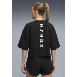 Damska skrócona koszulka PUMA x HYROX Lifestyle PUMA Black. Czarne bluzki Puma, xl, bez wzorów, sportowe, bez kołnierzyka, bez ramiączek. Za 179,00 zł.