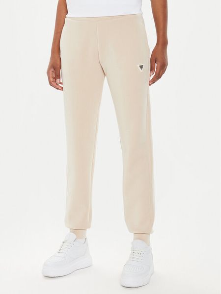 Guess Spodnie dresowe V4YB08 KCAY2 Beżowy Regular Fit. Brązowe spodnie dresowe Guess, xl, z aplikacjami, z dresówki. Za 189,99 zł.
