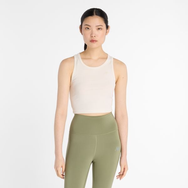 Koszulka damska New Balance WT43523PEF – beżowa. Brązowe bluzki New Balance, l, bez wzorów, z lyocellu, sportowe, bez kołnierzyka, bez ramiączek. Za 119,99 zł.