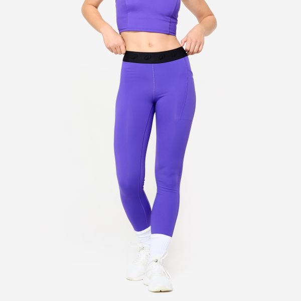 Legginsy fitness damskie Domyos. Fioletowe legginsy DOMYOS, bez wzorów, z elastanu. W wyprzedaży za 69,99 zł.