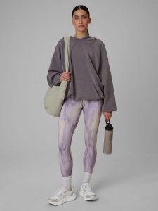 4F Legginsy treningowe szybkoschnące damskie - żółte XL. Żółte legginsy 4f, bez wzorów, z podwyższonym stanem. Za 149,99 zł.