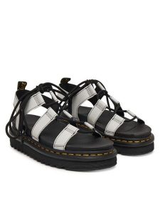 Dr. Martens Sandały Nartilla DM31617020 Szary. Szare sandały Dr. Martens, bez wzorów, ze skóry, bez obcasa, na płaskiej podeszwie, bez zapięcia. Za 599,99 zł.