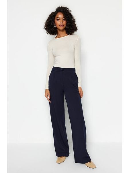 Trendyol Spodnie w kolorze granatowym rozmiar: 38. Niebieskie spodnie z wysokim stanem Trendyol, bez wzorów, z materiału, z podwyższonym stanem. Za 91,34 zł.