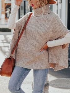 Milan Kiss Ponczo w kolorze beżowym rozmiar: L. Brązowe golfy Milan Kiss, bez wzorów, z polaru. Za 178,37 zł.