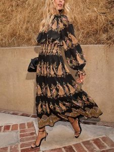 Milan Kiss Sukienka w kolorze karmelowo-czarnym rozmiar: XL. Brązowe sukienki Milan Kiss, xl, bez wzorów, bez kołnierzyka, bez ramiączek, maxi. Za 173,99 zł.