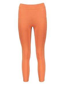 Gymshark Legginsy sportowe "KK Twins" w kolorze pomarańczowym rozmiar: M. Pomarańczowe legginsy Gymshark, bez wzorów, z materiału. Za 65,85 zł.