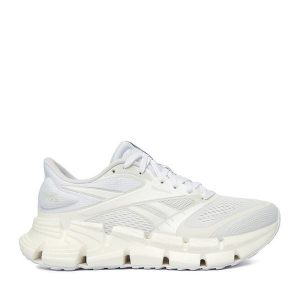 Sneakersy Reebok. Białe buty sportowe Reebok, bez wzorów, bez zapięcia, do biegania. Za 489,99 zł.