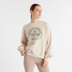 Bluza damska New Balance WT43553LIT – beżowa. Brązowe bluzy New Balance, s, bez wzorów, z bawełny, bez kaptura. Za 199,99 zł.