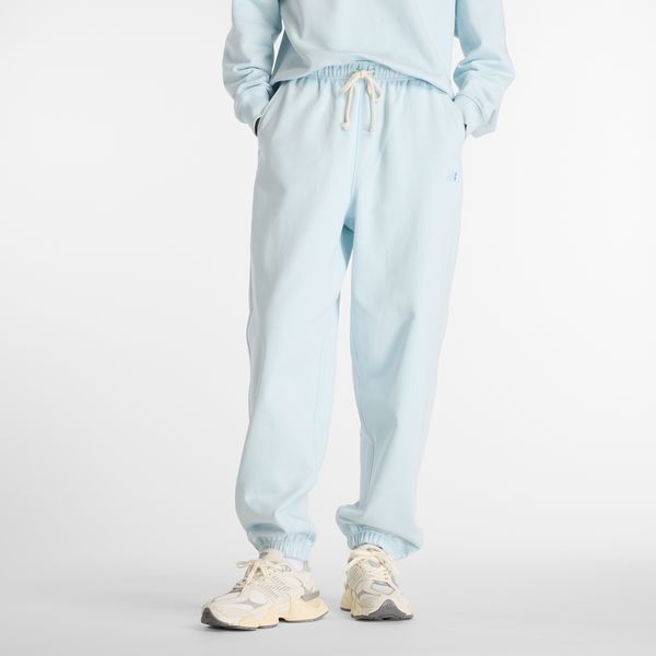Spodnie damskie New Balance WP41513FRL – niebieskie. Niebieskie spodnie dresowe New Balance, m, bez wzorów, z bawełny. Za 379,99 zł.