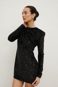 Sukienka z cekinami w kolorze BLACK- CONFETTI -XS. Czarne sukienki Marsala, na imprezę, l, bez wzorów, eleganckie, bez kołnierzyka, bez ramiączek, mini, dopasowane. Za 339,90 zł.