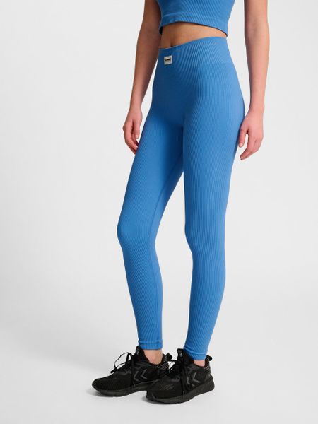 Damskie legginsy bezszwowe Hummel Pulse. Niebieskie legginsy Hummel, z aplikacjami, z dzianiny. Za 130,00 zł.