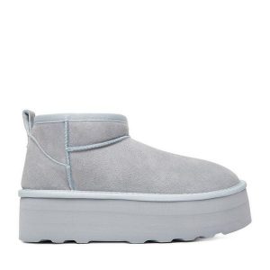 Śniegowce DeeZee. Niebieskie buty zimowe DeeZee, bez obcasa, bez zapięcia. Za 349,99 zł.